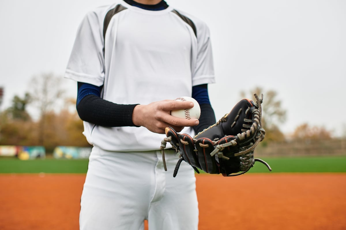 Confident baseball player preparing to pitch